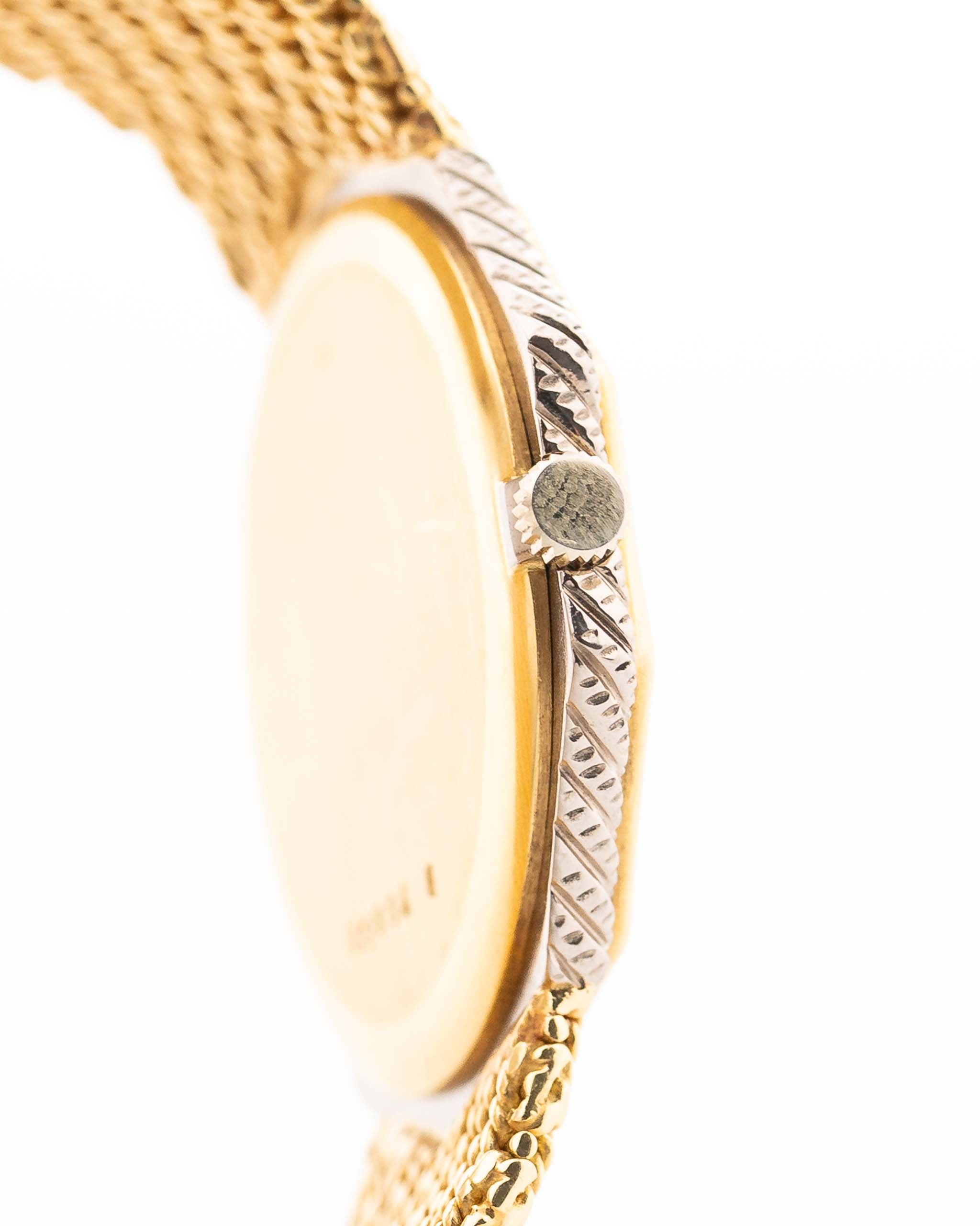 Closeup Photo of a Audemars Piguet Octagon Two Tone 18k from the 1980s. 30mm with 18k Yellow Gold Case, Golden Aventurine Dial, Manual Wind Movement and Yellow Gold Bracelet.