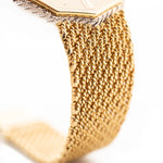 Closeup Photo of a Audemars Piguet Octagon Two Tone 18k from the 1980s. 30mm with 18k Yellow Gold Case, Golden Aventurine Dial, Manual Wind Movement and Yellow Gold Bracelet.