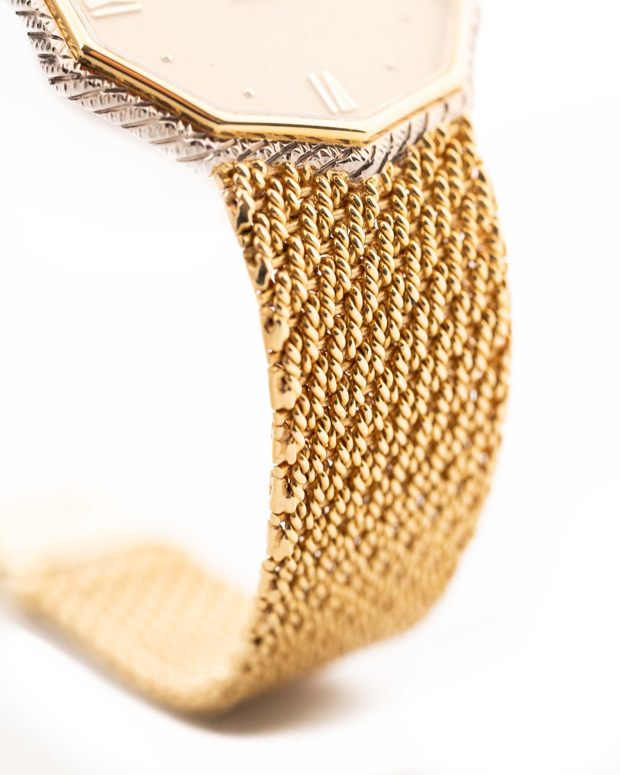 Closeup Photo of a Audemars Piguet Octagon Two Tone 18k from the 1980s. 30mm with 18k Yellow Gold Case, Golden Aventurine Dial, Manual Wind Movement and Yellow Gold Bracelet.