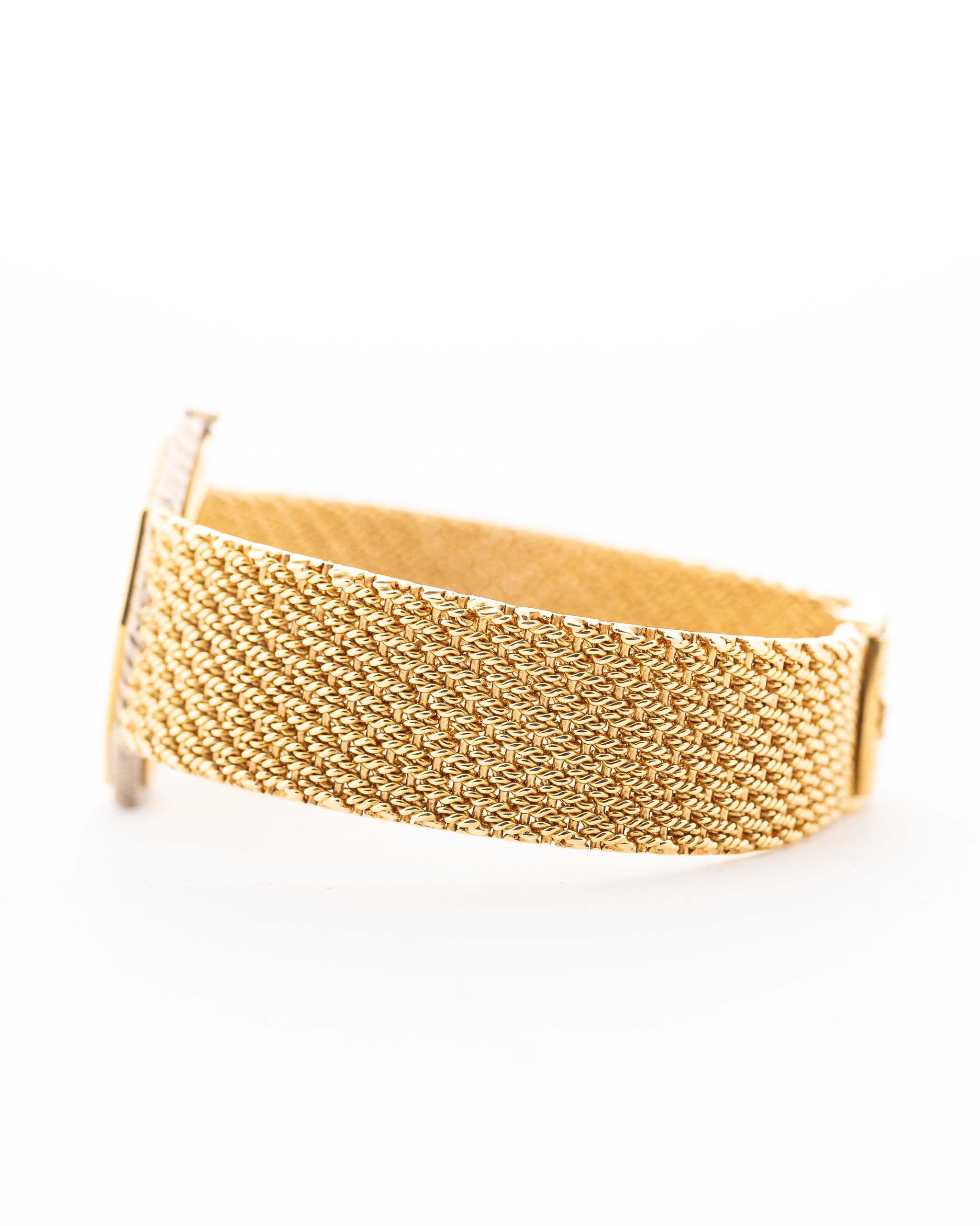 Closeup Photo of a Audemars Piguet Octagon bracelet Two Tone 18k from the 1980s. 30mm with 18k Yellow Gold Case, Golden Aventurine Dial, Manual Wind Movement and Yellow Gold Bracelet.