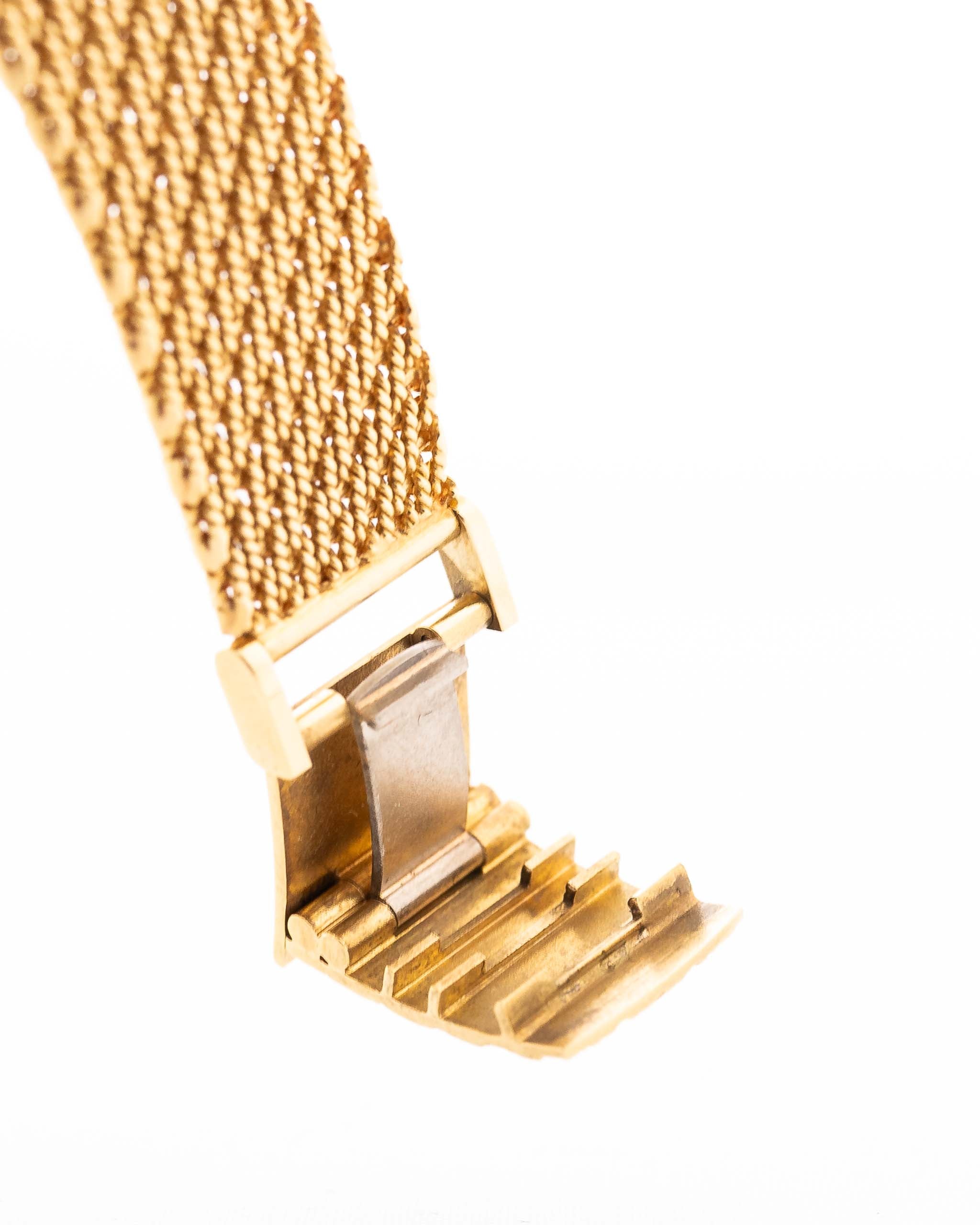 Closeup Photo of a Audemars Piguet Octagon Two Tone 18k from the 1980s. 30mm with 18k Yellow Gold Case, Golden Aventurine Dial, Manual Wind Movement and Yellow Gold Bracelet.