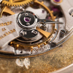 Closeup Photo of a Audemars Piguet Octagon Two Tone 18k from the 1980s. 30mm with 18k Yellow Gold Case, Golden Aventurine Dial, Manual Wind Movement and Yellow Gold Bracelet.