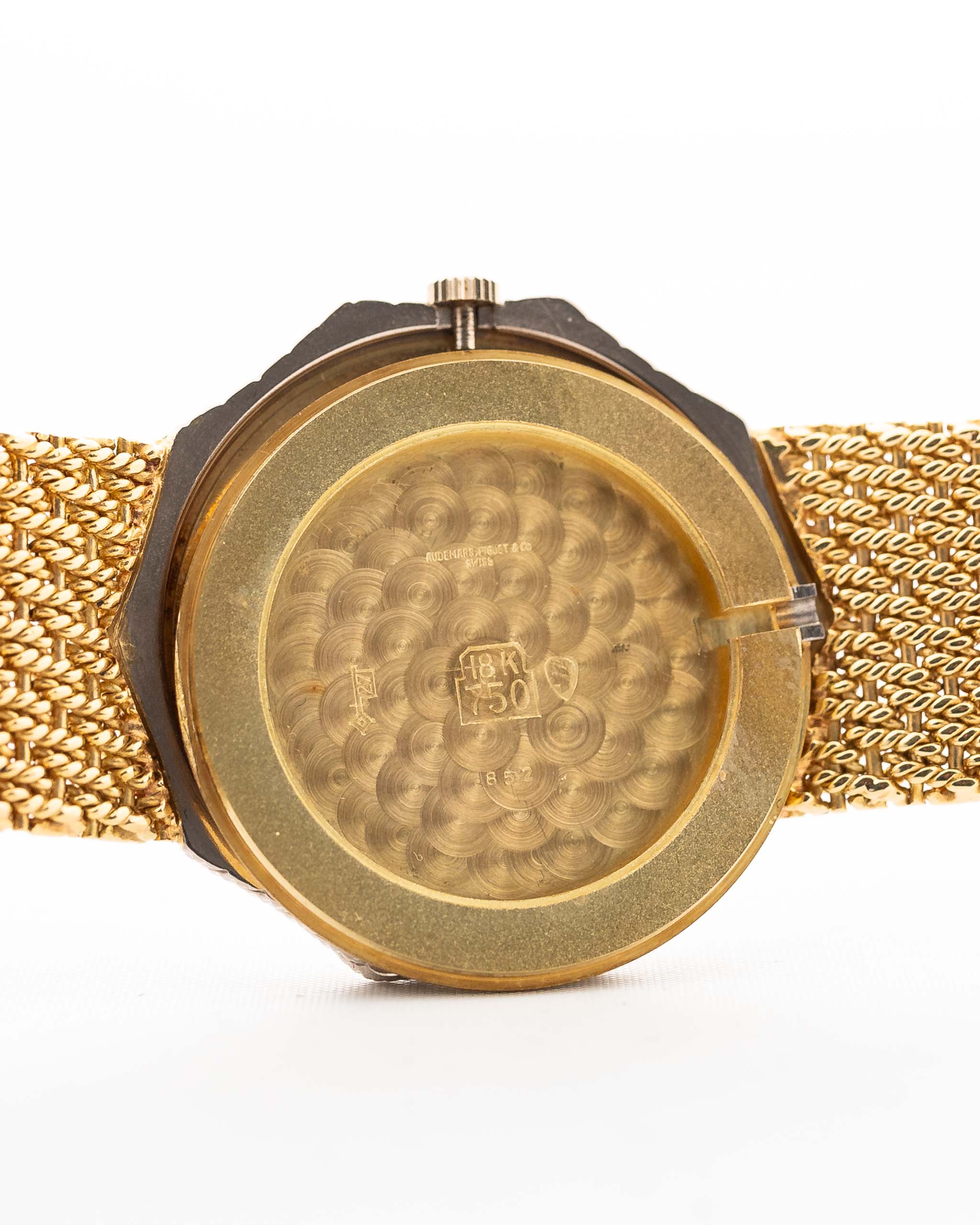 Closeup Photo of a Audemars Piguet Octagon Two Tone 18k from the 1980s. 30mm with 18k Yellow Gold Case, Golden Aventurine Dial, Manual Wind Movement and Yellow Gold Bracelet.