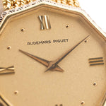 Closeup Photo of a Audemars Piguet Octagon Two Tone 18k from the 1980s. 30mm with 18k Yellow Gold Case, Golden Aventurine Dial, Manual Wind Movement and Yellow Gold Bracelet.