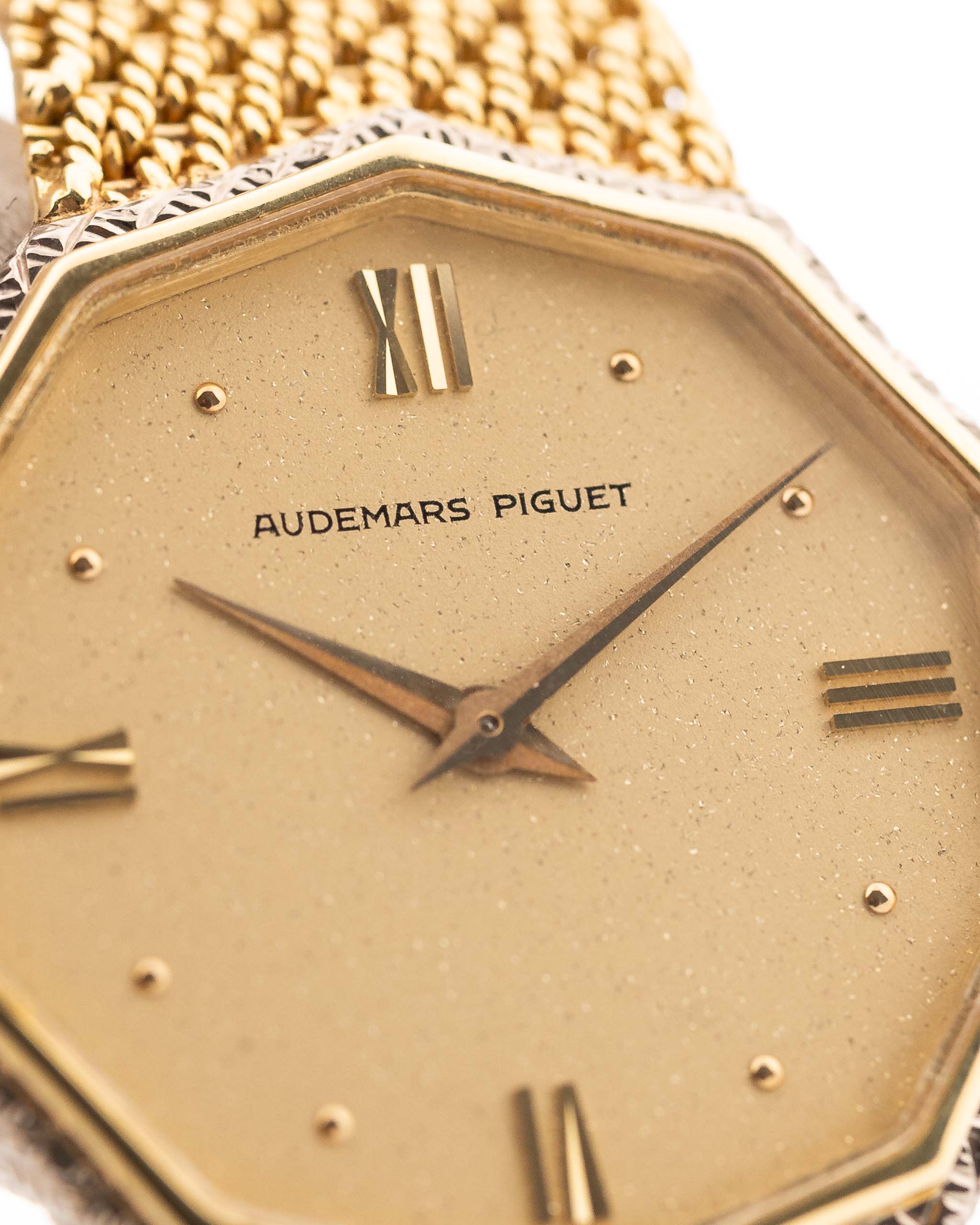 Closeup Photo of a Audemars Piguet Octagon Two Tone 18k from the 1980s. 30mm with 18k Yellow Gold Case, Golden Aventurine Dial, Manual Wind Movement and Yellow Gold Bracelet.