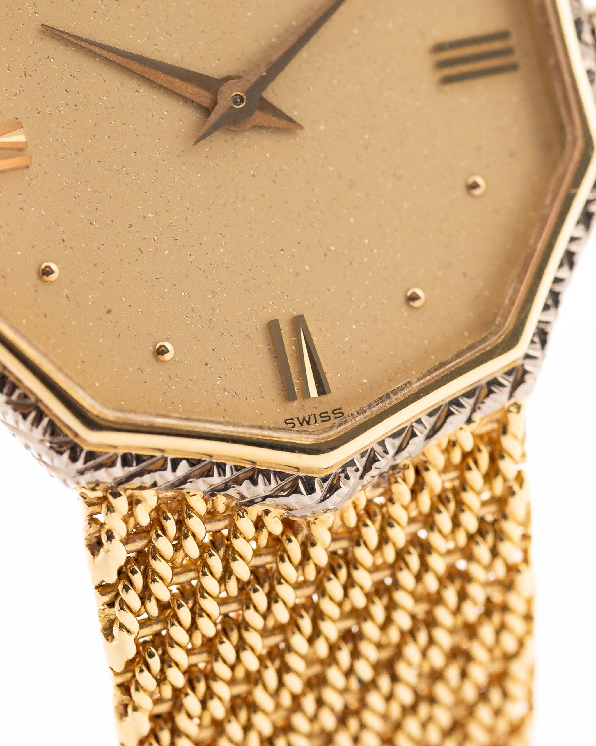 Closeup Photo of a Audemars Piguet Octagon Two Tone 18k from the 1980s. 30mm with 18k Yellow Gold Case, Golden Aventurine Dial, Manual Wind Movement and Yellow Gold Bracelet.