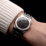 Photo of a Vintage Audemars Piguet Royal Oak 6008ST from 1980s on a wrist. Stainless Steel, 30mm with original black tapisserie dial and Quartz movement.