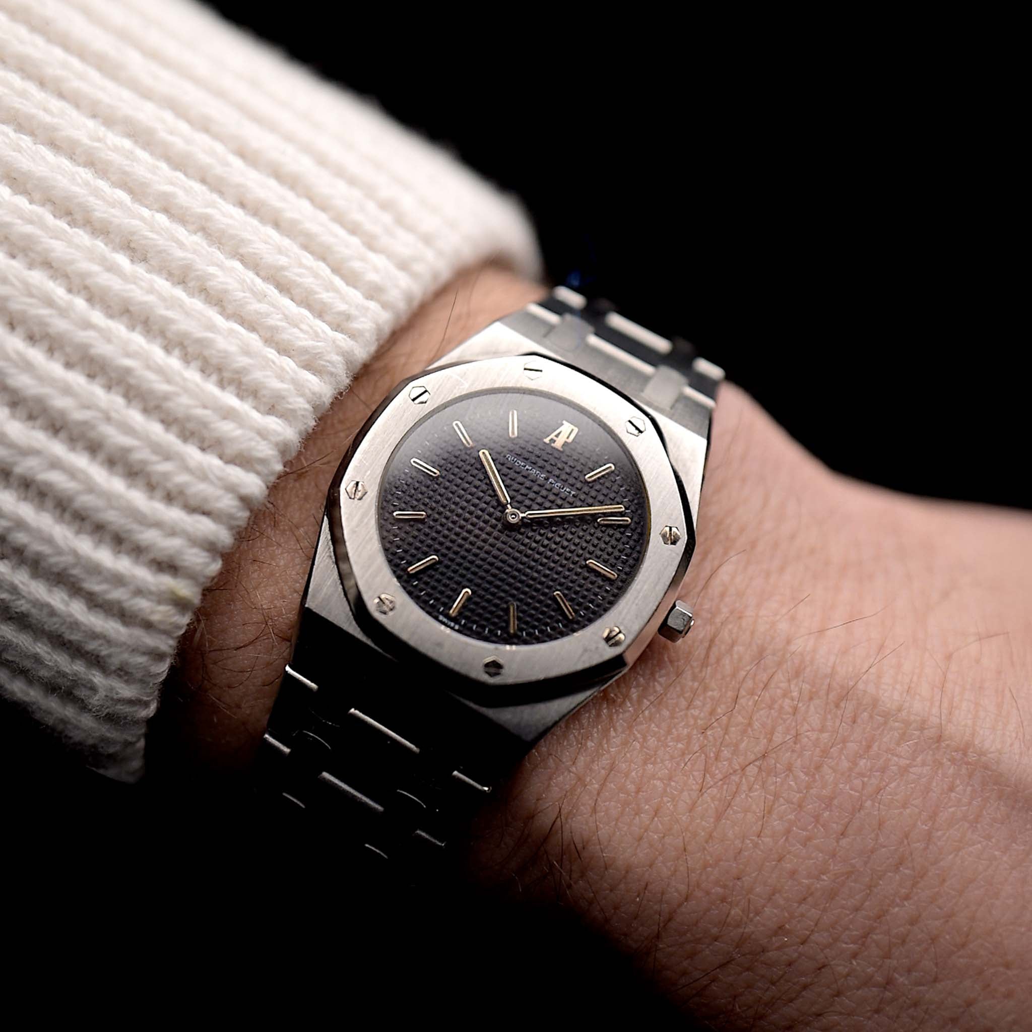 Photo of a Vintage Audemars Piguet Royal Oak 6008ST from 1980s on a wrist. Stainless Steel, 30mm with original black tapisserie dial and Quartz movement.