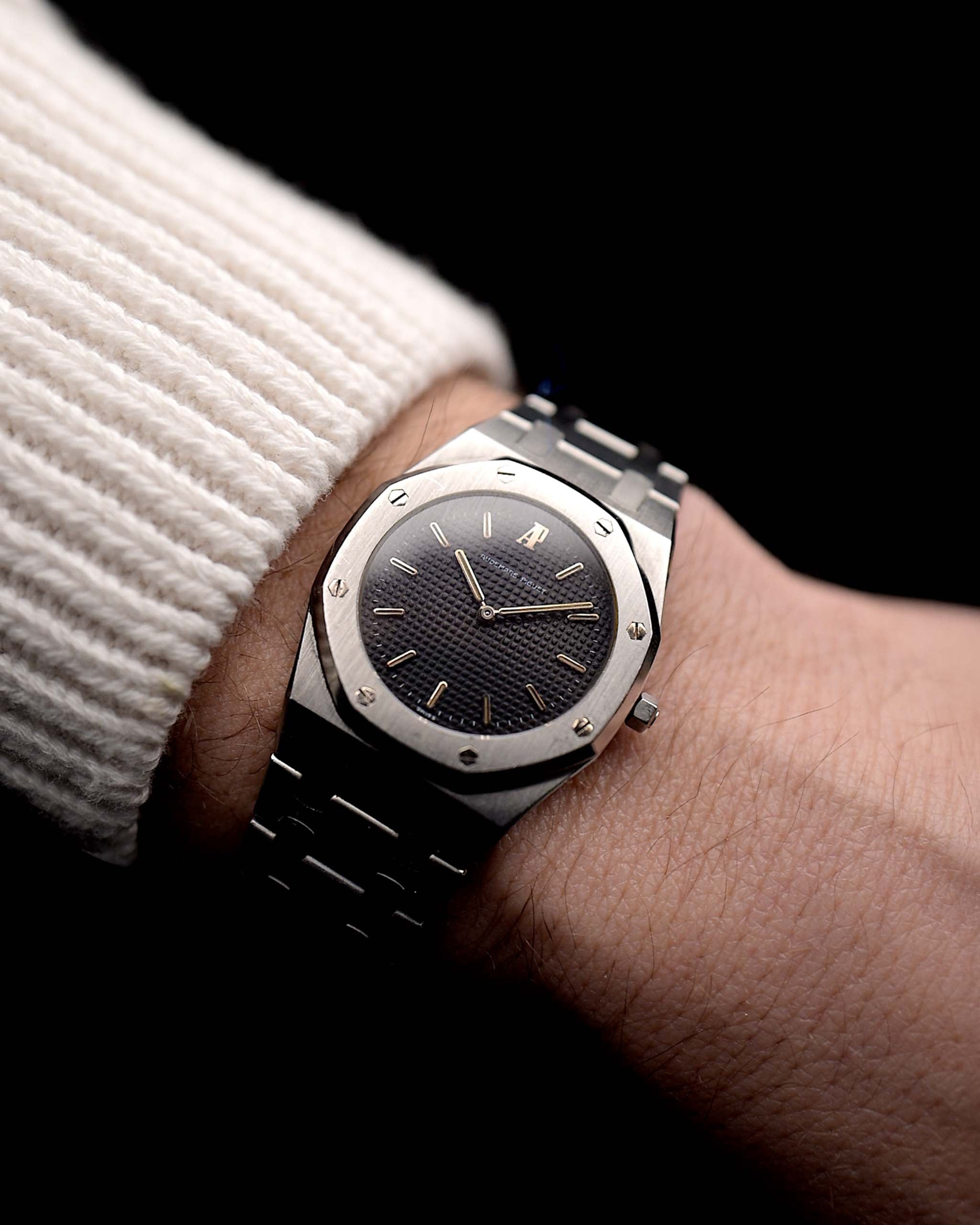 Photo of a Vintage Audemars Piguet Royal Oak 6008ST from 1980s on a wrist. Stainless Steel, 30mm with original black tapisserie dial and Quartz movement.