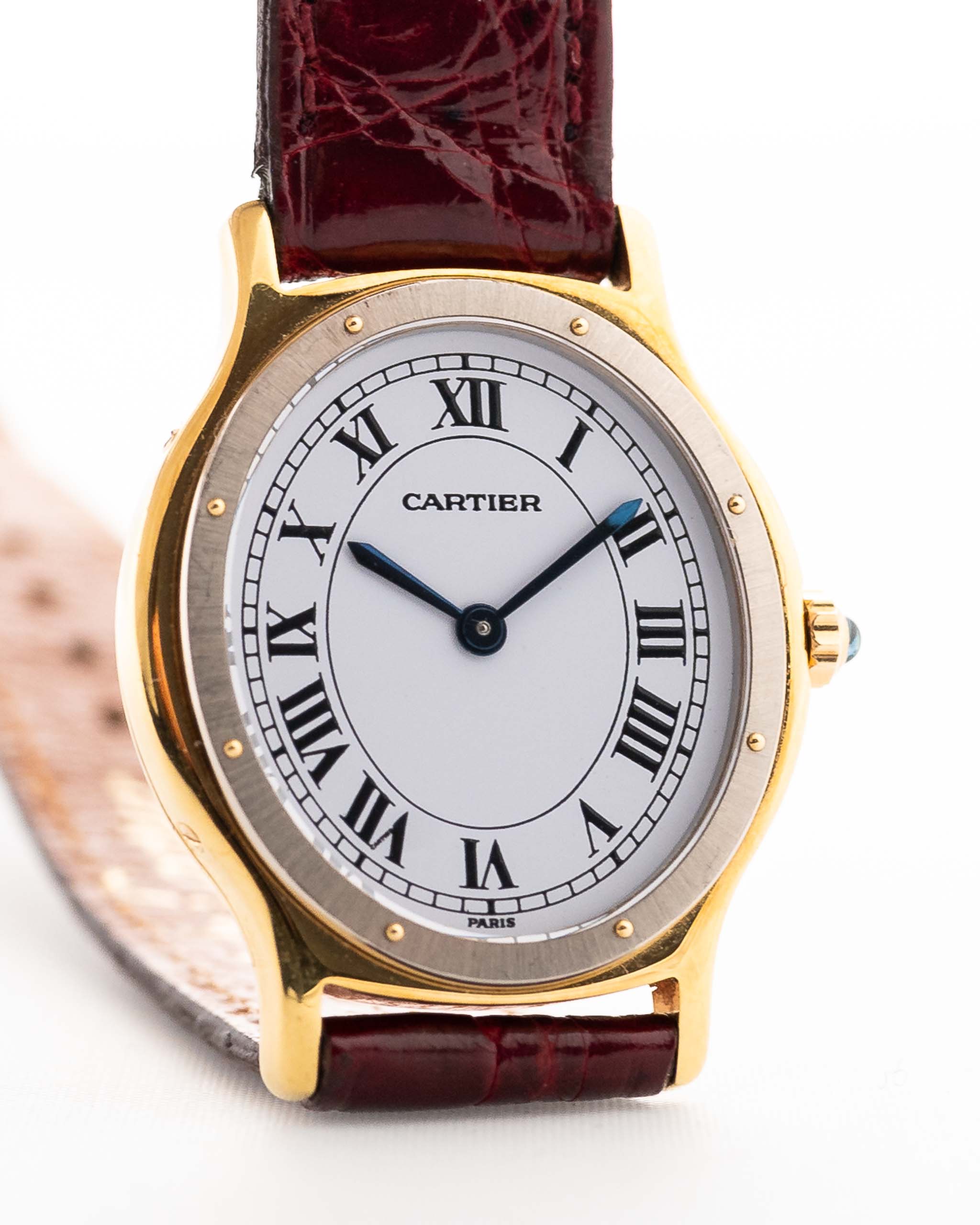 Vintage Cartier Arcade Paris Watch 9605 Two Tone from the 1980s. 18k Yellow Gold Case, White Gold Bezel, White Paris Dial, Manual Wind Movement and Red Leather Strap.