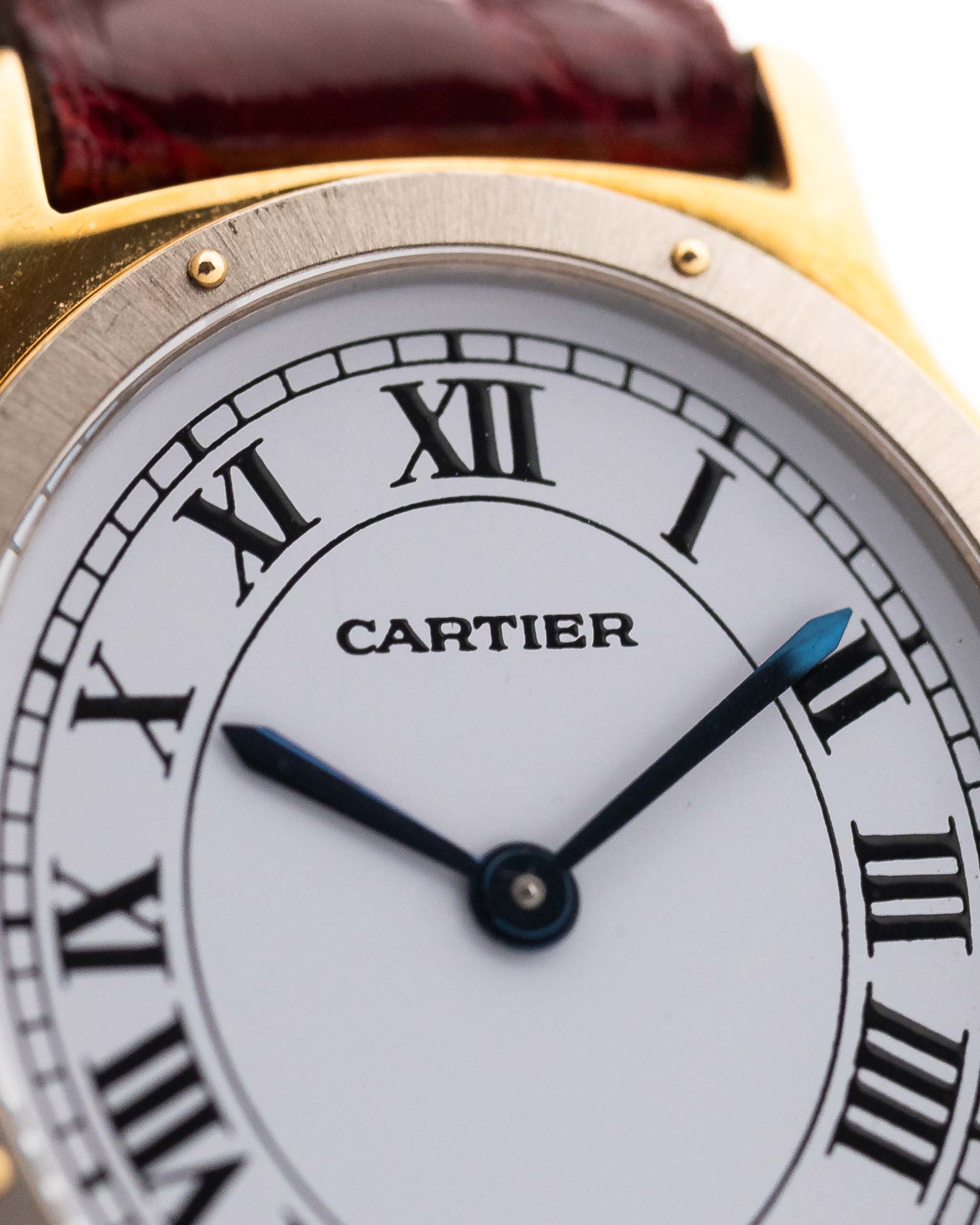 Vintage Cartier Arcade Paris Watch 9605 Two Tone from the 1980s. 18k Yellow Gold Case, White Gold Bezel, White Paris Dial, Manual Wind Movement and Red Leather Strap.