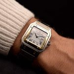 Vintage Cartier Santos 2961 Carrée Two Tone watch from the 1990s on a wrist. 29mm in Stainless Steel & 18k Yellow Gold with Automatic movement, Flawless white dial and Two Tone bracelet.