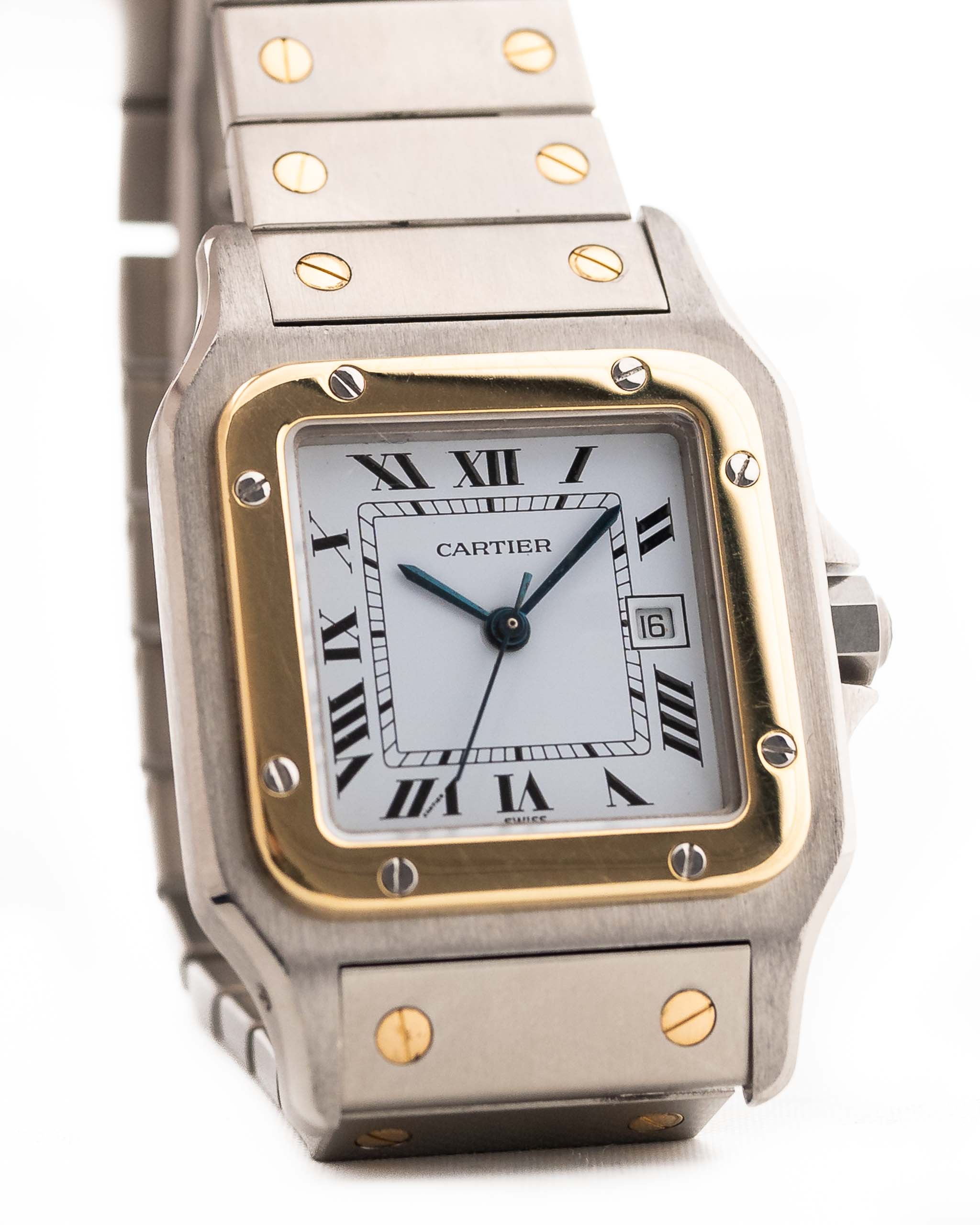 Closeup Photo of a Vintage Cartier Santos Carrée 2961 Two Tone from 1990s on wrist. Two-tone stainless steel, Original white dial, Automatic movement and original bracelet.