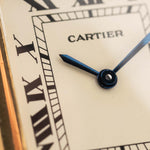 Closeup of a Vintage Cartier Tank Louis 78086 Paris Dial from the 1970s. 23x30mm with 18k Yellow Gold Case, Manual Wind Movement, Flawless Ivory Dial, Hands and Leather Strap.