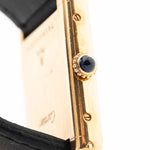 Closeup of a Vintage Cartier Tank Louis 78086 Paris Case from the 1970s. 23x30mm with 18k Yellow Gold Case, Manual Wind Movement, Flawless Ivory Dial, Hands and Leather Strap.