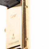 Closeup of a Vintage Cartier Tank Louis 78086 Paris Case from the 1970s. 23x30mm with 18k Yellow Gold Case, Manual Wind Movement, Flawless Ivory Dial, Hands and Leather Strap.