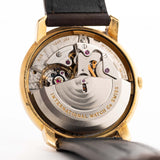 Closeup of a Vintage IWC de Luxe automatic 18k 1959 Movement. 35mm with 18k Yellow Gold Case, Automatic Caliber 8531, flawless Pie Pan Dial and Leather Strap.