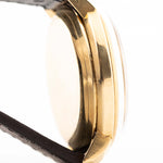 Closeup of a Vintage IWC de Luxe automatic 18k 1959 Case. 35mm with 18k Yellow Gold Case, Automatic Caliber 8531, flawless Pie Pan Dial and Leather Strap.