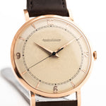 Rosegold Vintage Jaeger LeCoultre 18k Rose Railroad watch from the 1950s on a white background. 35mm wide with 18k Rose Gold Case, Manual Wind Caliber P450/4C, Cream Dial and Brown Leather Strap.