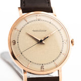 Rosegold Vintage Jaeger LeCoultre 18k Rose Railroad watch from the 1950s on a white background. 35mm wide with 18k Rose Gold Case, Manual Wind Caliber P450/4C, Cream Dial and Brown Leather Strap.