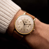 Longines 7414 flyback chronograph vintage watch, 18k gold, silver dial, worn on the wrist