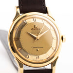 Closeup Photo of a Omega Constellation 2852 Pie Pan Arrow from 1956. 35mm case in Yellow Gold Case, Automatic Chronometer Caliber 505, Gold Pie Pan Dial, Brown Leather Strap.