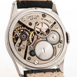 Closeup Photo of a Omega Radium Sword Arabic  from 1935 on a wrist. 28mm case in Stainless Steel with Manual wind movement, Original golden dial, Radium lume and Leather strap.
