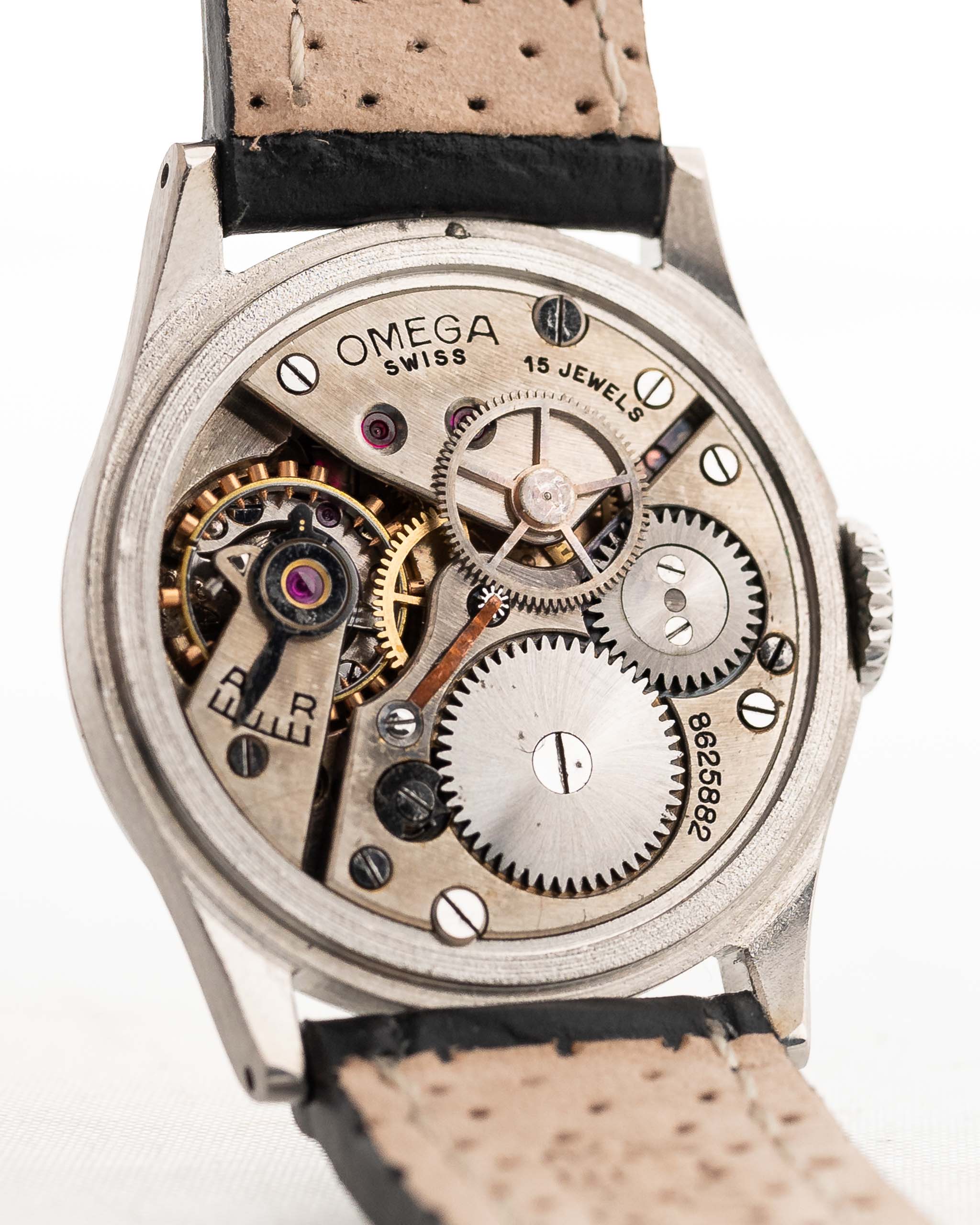 Closeup Photo of a Omega Radium Sword Arabic  from 1935 on a wrist. 28mm case in Stainless Steel with Manual wind movement, Original golden dial, Radium lume and Leather strap.