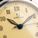Closeup Photo of a Omega Radium Sword Arabic  from 1935 on a wrist. 28mm case in Stainless Steel with Manual wind movement, Original golden dial, Radium lume and Leather strap.