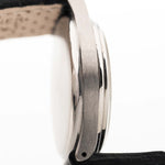 Closeup Photo of a Omega Radium Sword Arabic  from 1935 on a wrist. 28mm case in Stainless Steel with Manual wind movement, Original golden dial, Radium lume and Leather strap.