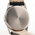 Closeup Photo of a Omega Radium Sword Arabic  from 1935 on a wrist. 28mm case in Stainless Steel with Manual wind movement, Original golden dial, Radium lume and Leather strap.
