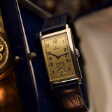 Omega T17 Art Deco golden dial with Arabic numerals and small seconds, steel case