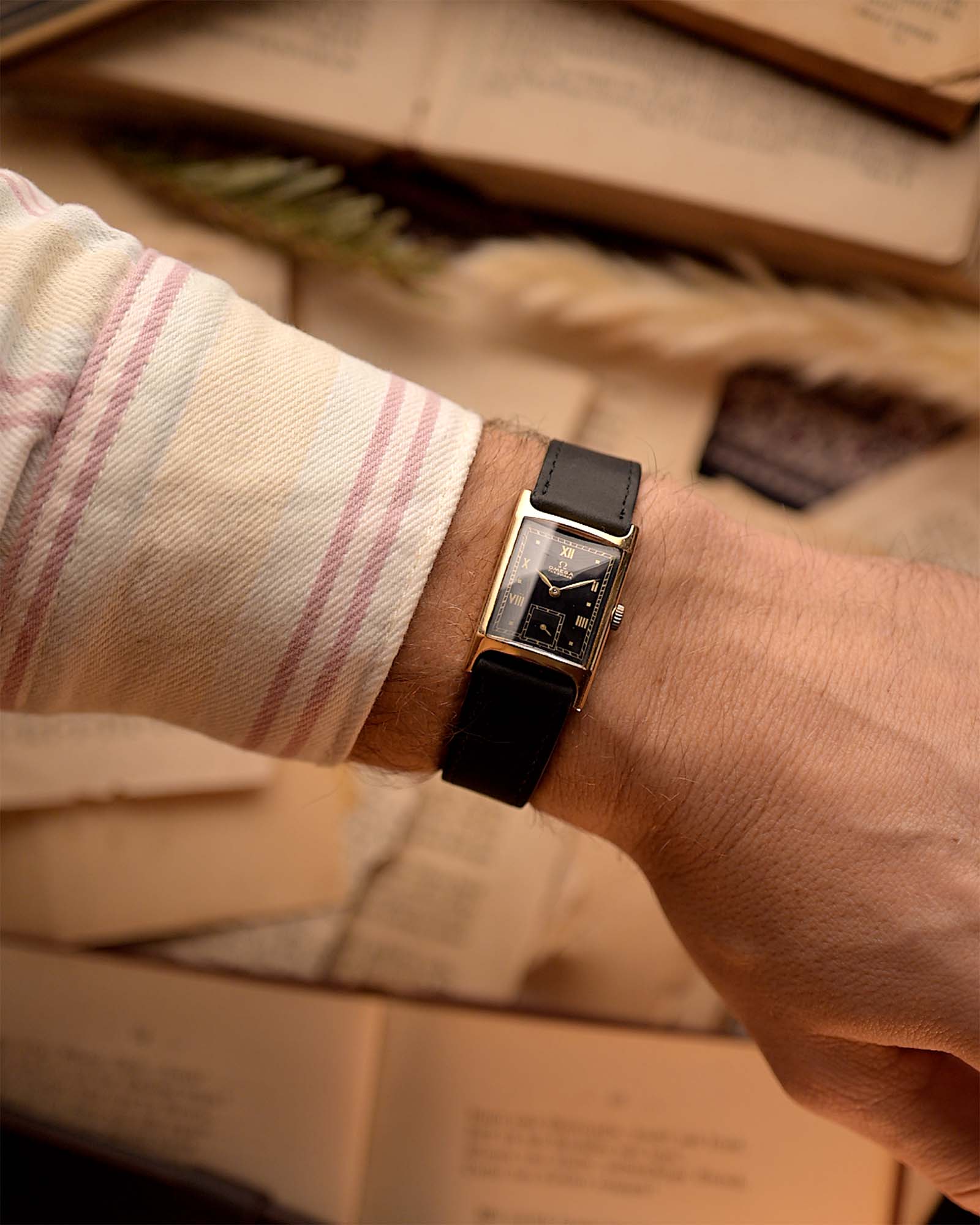 Vintage Omega Tank Gilt watch Roman from 1944 on a wrist. 