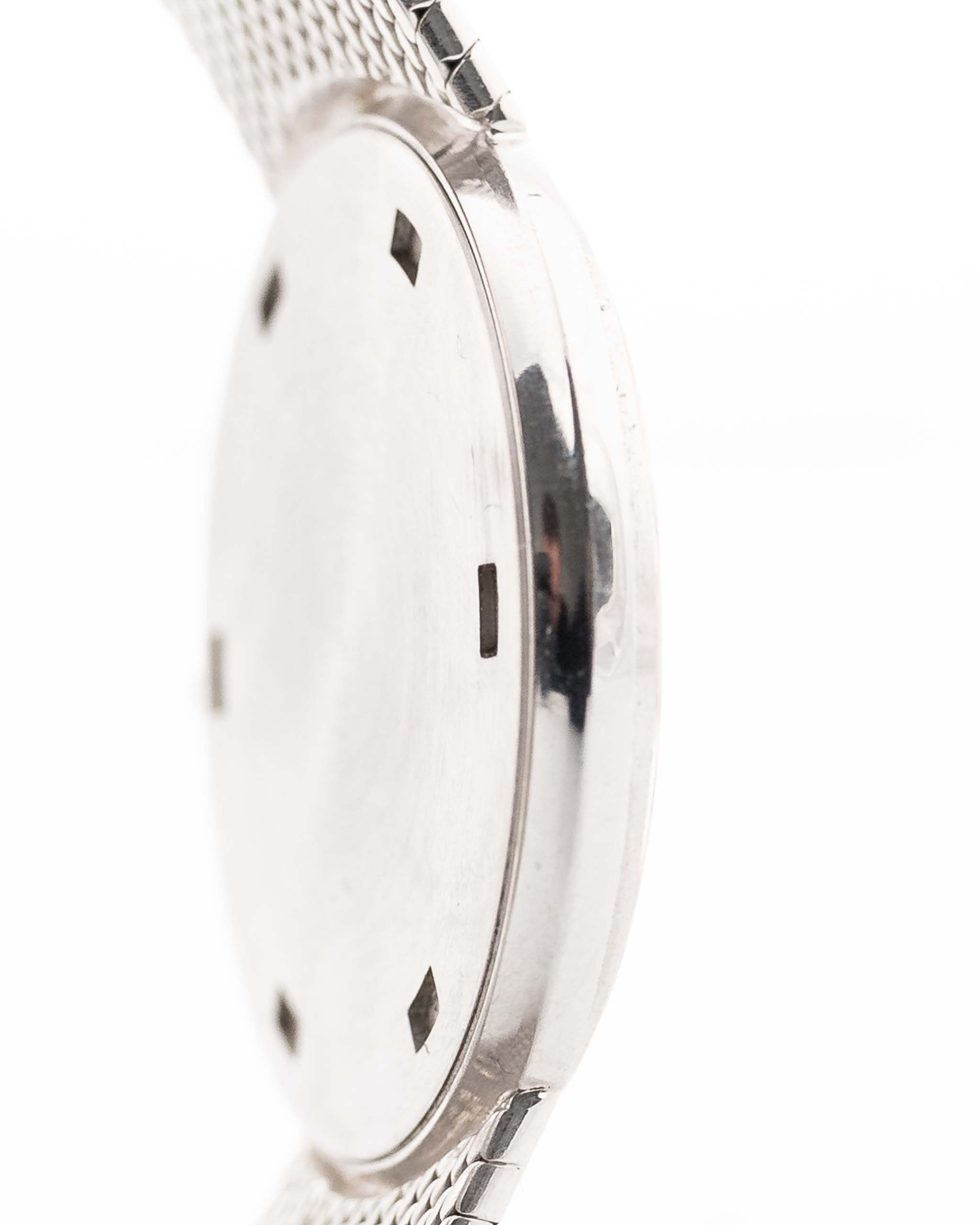 Closeup Photo of a Patek Philippe 3520 Calatrava 18k from the 1970s. 32mm 18k White Gold Case with Manual Wind Movement, Original Silver Sunburst Dial and White Gold Bracelet.