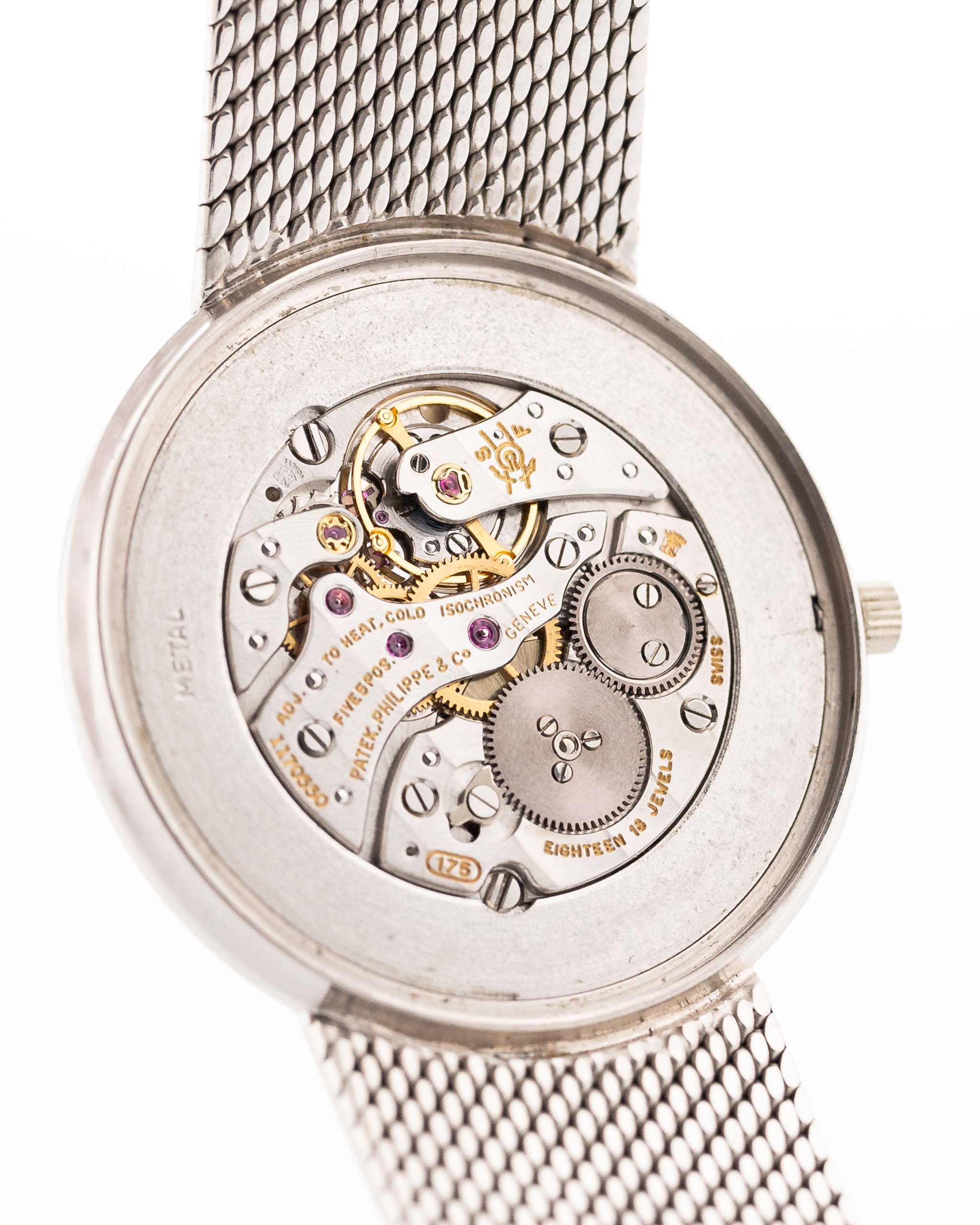 Closeup Photo of a Patek Philippe 3520 Calatrava 18k from the 1970s. 32mm 18k White Gold Case with Manual Wind Movement, Original Silver Sunburst Dial and White Gold Bracelet.