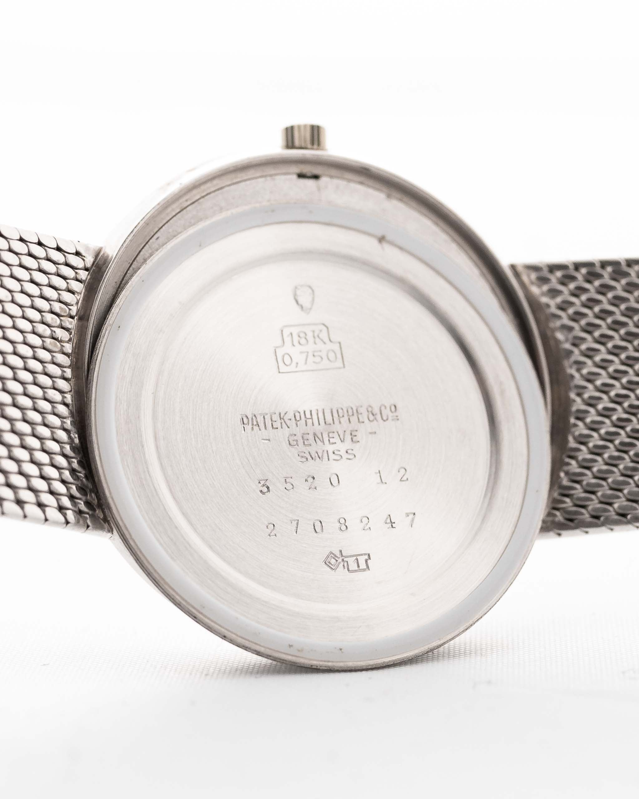 Closeup Photo of a Patek Philippe 3520 Calatrava 18k from the 1970s. 32mm 18k White Gold Case with Manual Wind Movement, Original Silver Sunburst Dial and White Gold Bracelet.