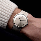 Photo of a Patek Philippe 3520 Calatrava 18k from the 1970s on a wrist. 32mm 18k White Gold Case with Manual Wind Movement, Original Silver Sunburst Dial and White Gold Bracelet.