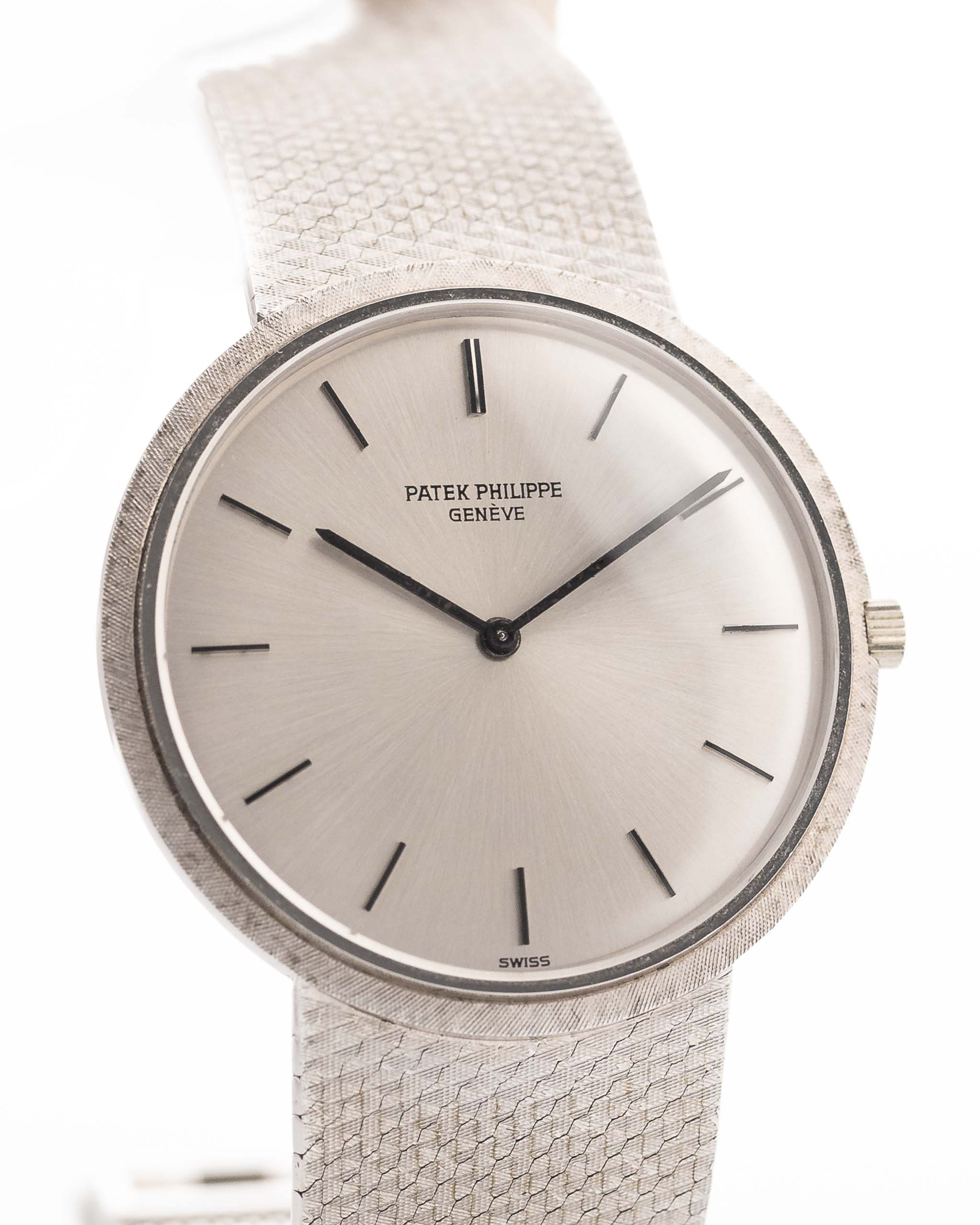 Closeup Photo of a Patek Philippe 3520 Calatrava 18k from the 1970s. 32mm 18k White Gold Case with Manual Wind Movement, Original Silver Sunburst Dial and White Gold Bracelet.