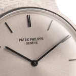 Closeup Photo of a Patek Philippe 3520 Calatrava 18k from the 1970s. 32mm 18k White Gold Case with Manual Wind Movement, Original Silver Sunburst Dial and White Gold Bracelet.