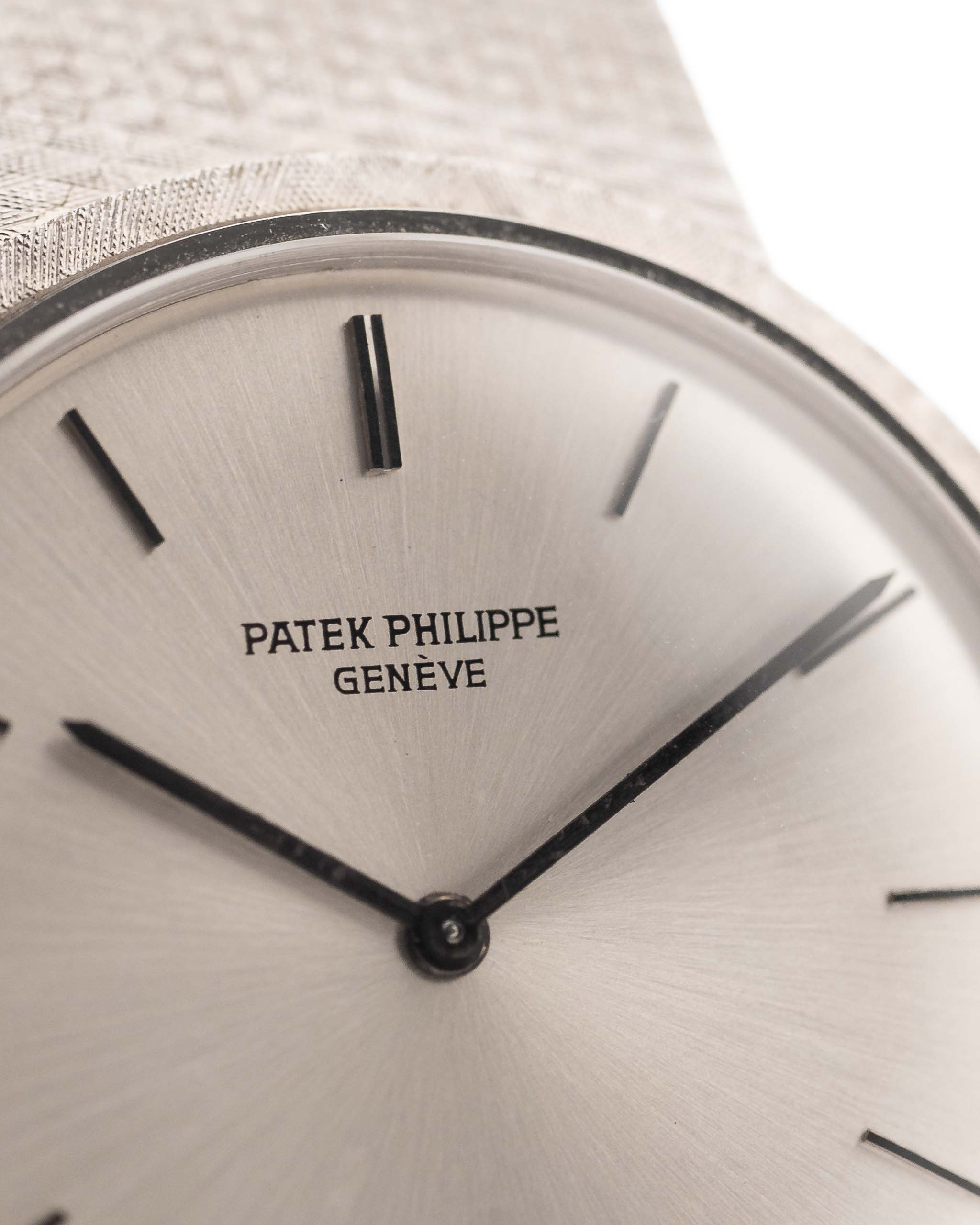 Closeup Photo of a Patek Philippe 3520 Calatrava 18k from the 1970s. 32mm 18k White Gold Case with Manual Wind Movement, Original Silver Sunburst Dial and White Gold Bracelet.