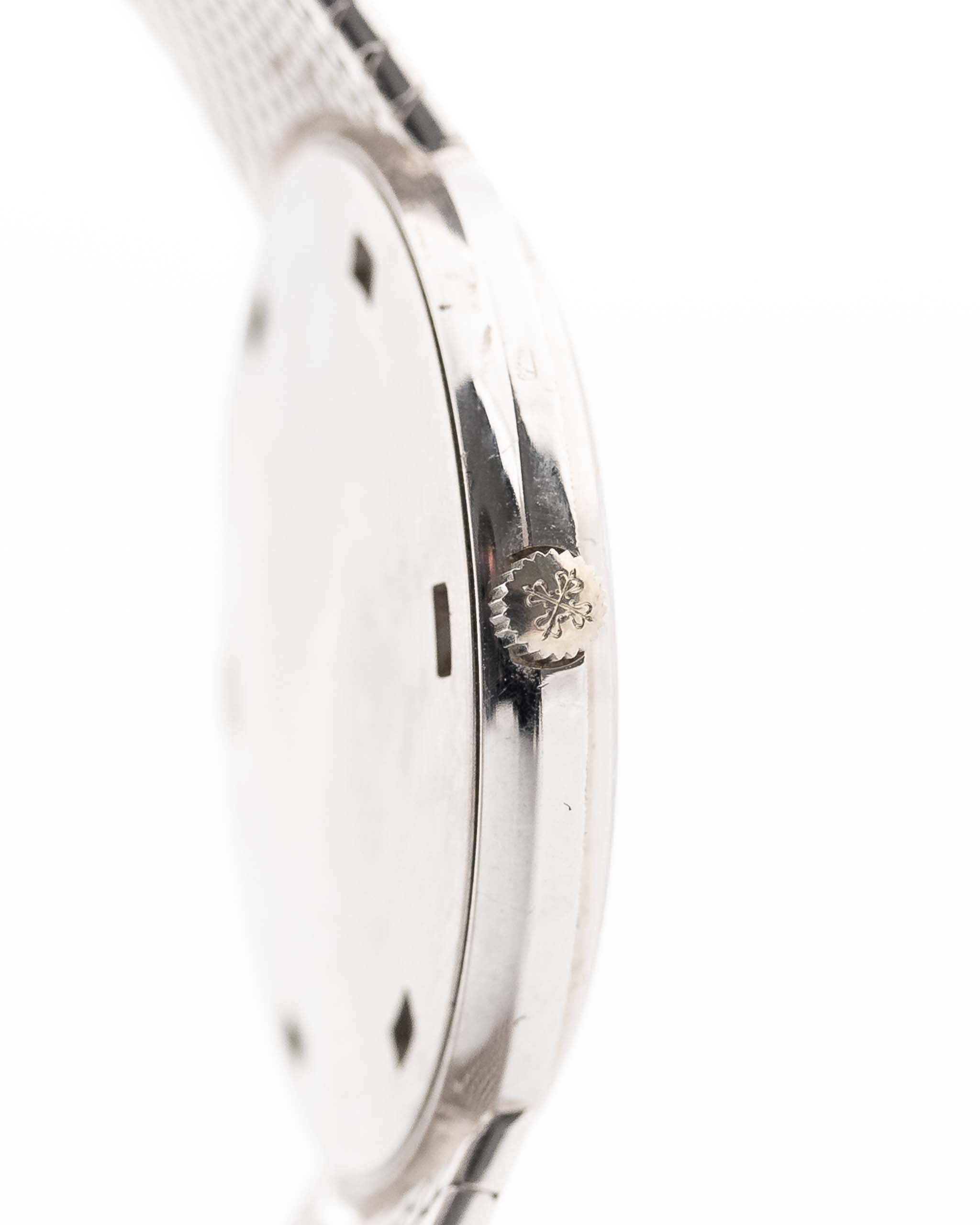 Closeup Photo of a Patek Philippe 3520 Calatrava 18k from the 1970s. 32mm 18k White Gold Case with Manual Wind Movement, Original Silver Sunburst Dial and White Gold Bracelet.