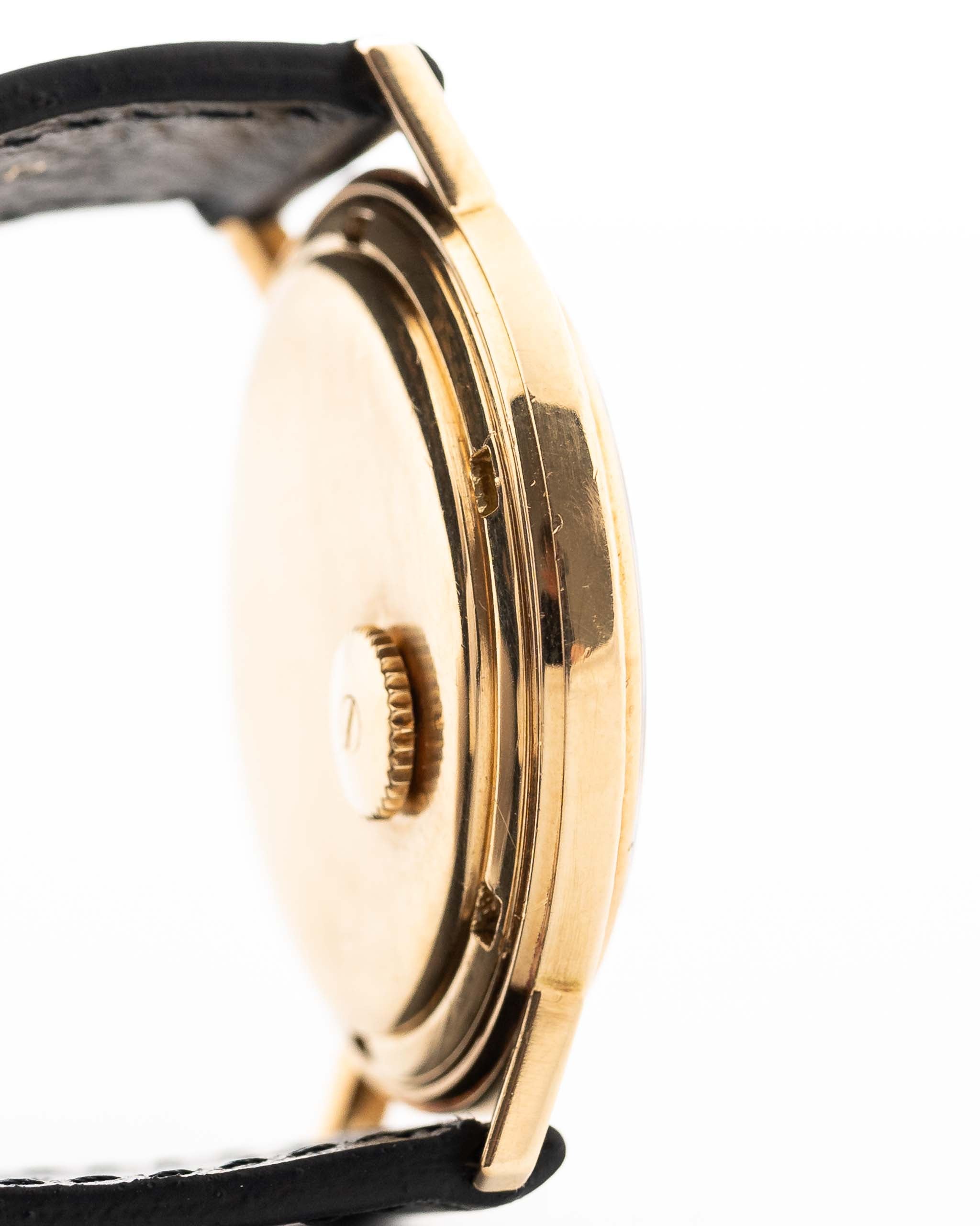 Closeup Photo of a Patek Philippe Calatrava 3569 Hammered 1970 on a wrist. 36mm case in 18k Yellow Gold Case wth Hammered Gold Dial, Automatic Movement and Original Leather Strap.