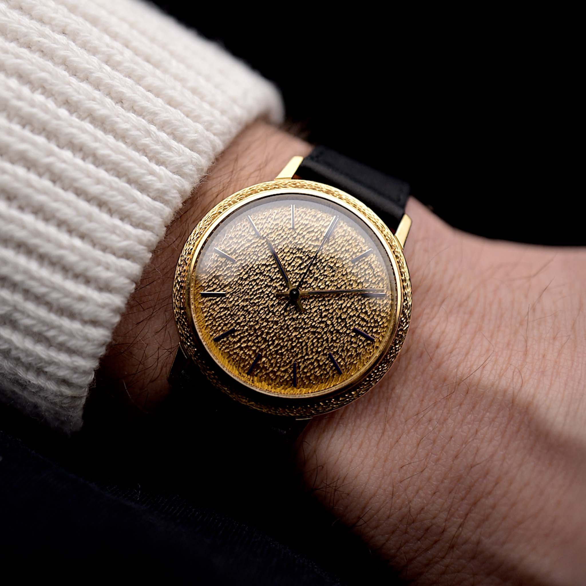 Photo of a Patek Philippe Calatrava 3569 Hammered 1970 on a wrist. 36mm case in 18k Yellow Gold Case wth Hammered Gold Dial, Automatic Movement and Original Leather Strap.