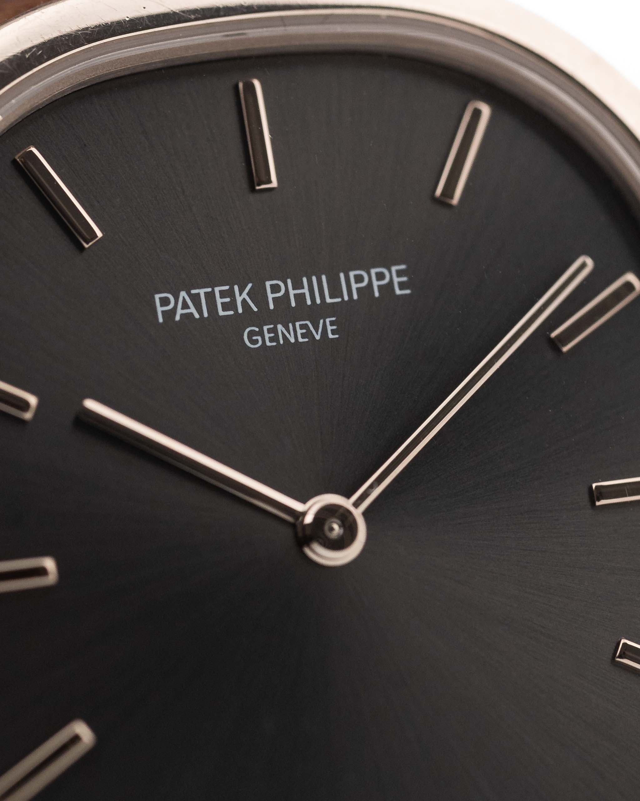 Vintage Patek Philippe Ellipse 3738 Grey 18k white gold 1980s with grey sunburst dial closeup Hands and markers