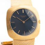 Closeup Photo of a Vintage Patek Philippe Square 3543 Blue from the 1970s on a wrist. In 18k Yellow Gold, 31mm with Manual Wind Movement and Original Blue Dial, Integrated Yellow Gold Bracelet.