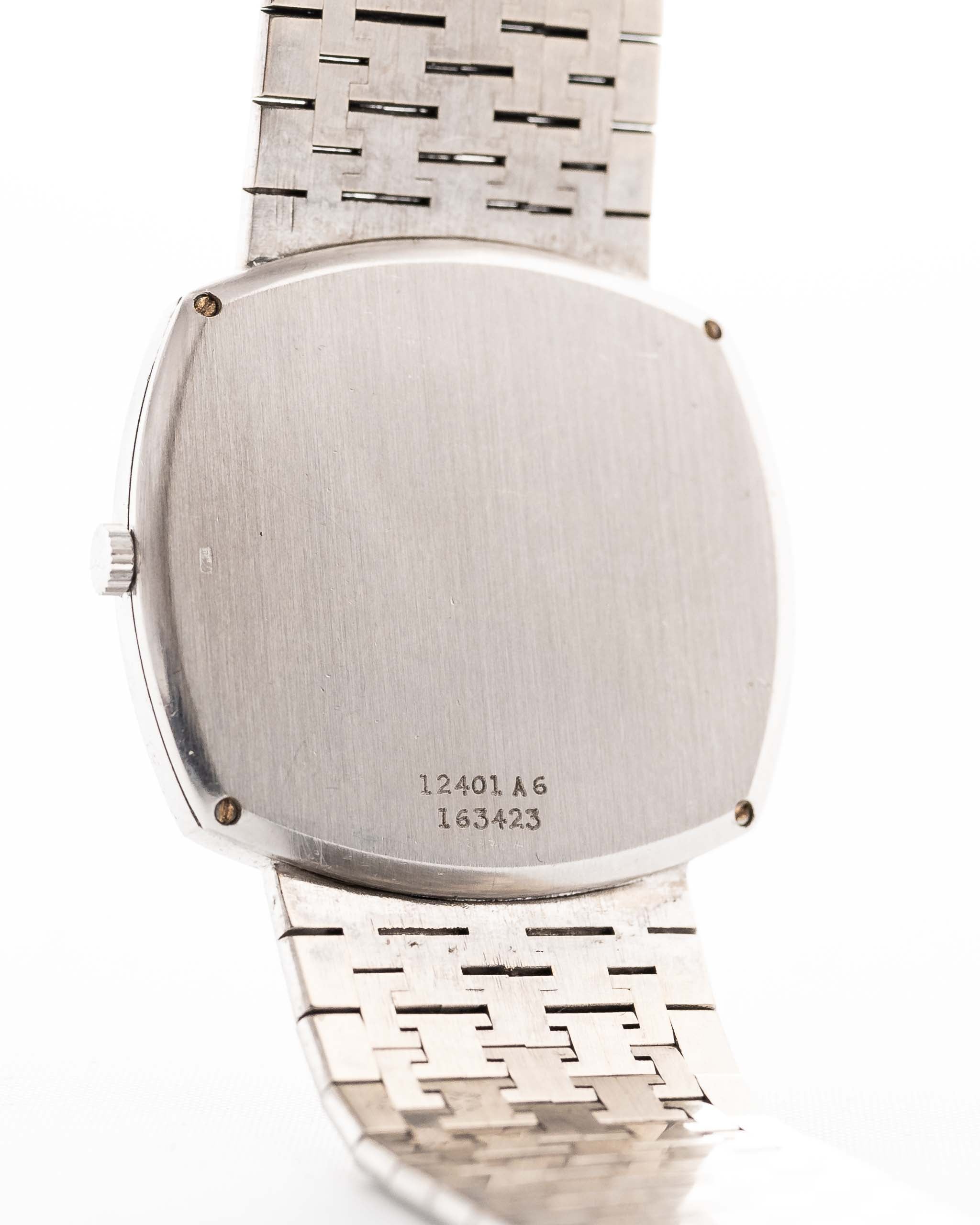 Closeup Photo of a Piaget 12401 Automatic 18k TV Bark from the 1970s on a wrist. 32.5mm with 18k White Gold Case, Automatic Movement, White Gold Hammered Dial and Integrated 18k.