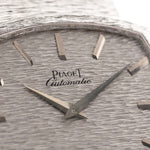 Closeup Photo of a Piaget 12401 Automatic 18k TV Bark from the 1970s on a wrist. 32.5mm with 18k White Gold Case, Automatic Movement, White Gold Hammered Dial and Integrated 18k.