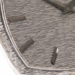 Closeup Photo of a Piaget 12401 Automatic 18k TV Bark from the 1970s on a wrist. 32.5mm with 18k White Gold Case, Automatic Movement, White Gold Hammered Dial and Integrated 18k.