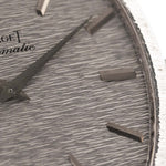 Closeup Photo of a Piaget 12401 Automatic 18k TV Bark from the 1970s on a wrist. 32.5mm with 18k White Gold Case, Automatic Movement, White Gold Hammered Dial and Integrated 18k.
