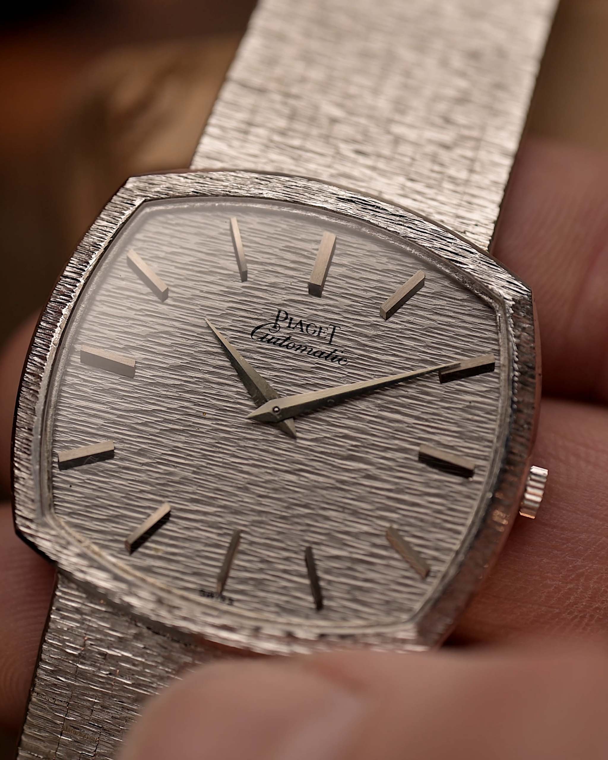 Close up of Vintage Piaget TV 12401 Bark watch white gold on blurred background